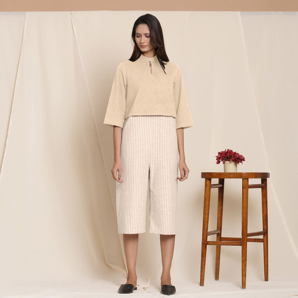 Front View of a Model wearing Beige Warm Cotton Flannel Knee Length Yoked Jumpsuit