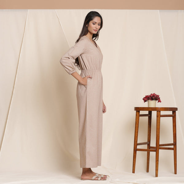 Right View of a Model wearing Dusk Brown Cotton Elasticated Surplice Neck Overalls Jumpsuit