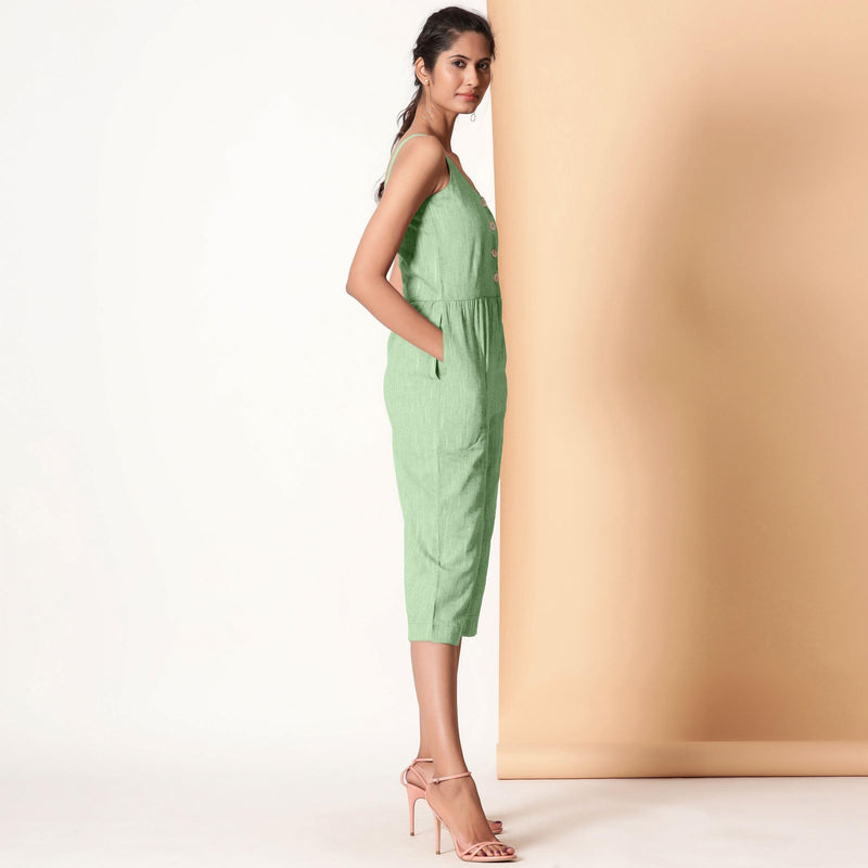 Right View of a Model wearing Green Cotton Sleeveless Button-Down Jumpsuit