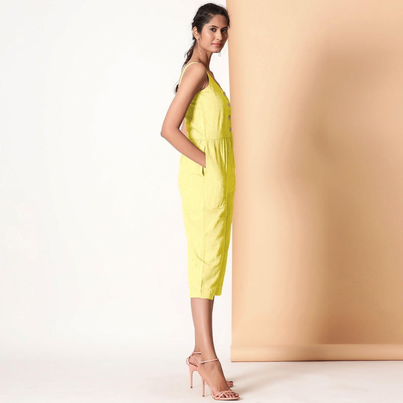 Right View of a Model wearing Lemon Yellow Cotton Sleeveless Button-Down Jumpsuit