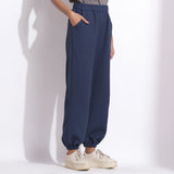 Left View of a Model wearing Comfy Navy Blue Cotton Waffle Jogger Pant