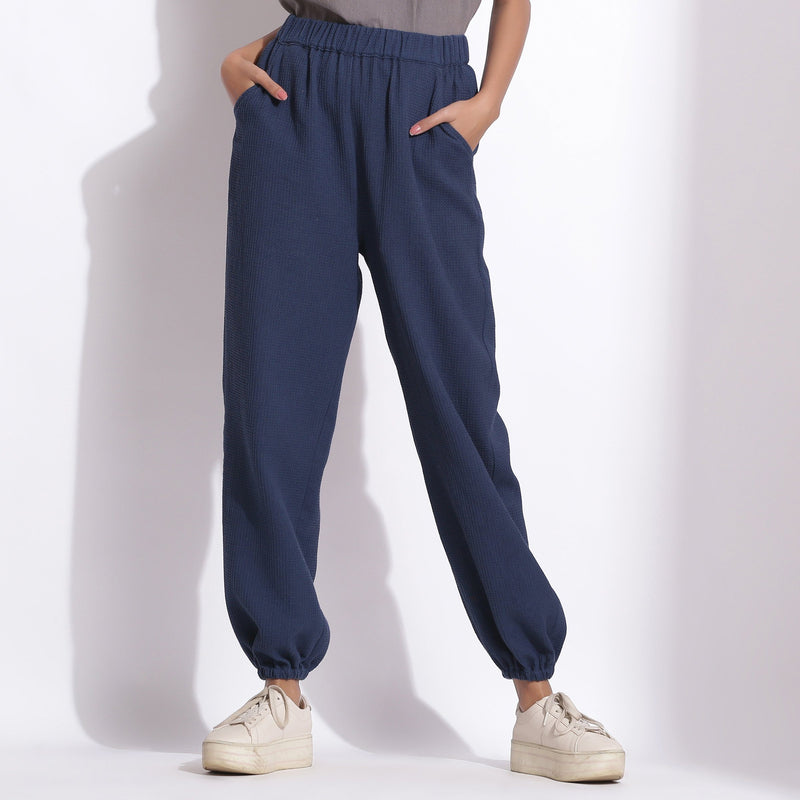 Front View of a Model wearing Comfy Navy Blue Cotton Waffle Jogger Pant