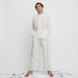 Front View of a Model wearing Crisp White Organic Cotton Top and Pant Set