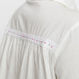 Back Detail of a Model wearing White Cotton Lined Button-Down Top