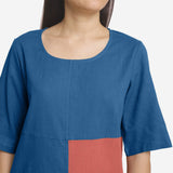 Front Detail of a Model wearing Comfy Teal and Brick Red Straight Top