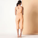 Back View of a Model wearing Yellow Cotton Sleeveless Button-Down Jumpsuit
