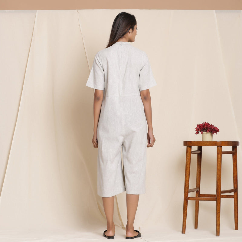 Back View of a Model wearing Cotton Cloudy Grey Box Pleated Jumpsuit