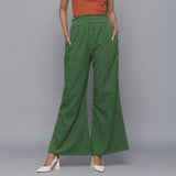 Front View of a Model wearing Green Corduroy Striped Bootcut Pant