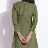 Back Detail of a Model wearing Cotton Corduroy Sage Green Surplice Dress