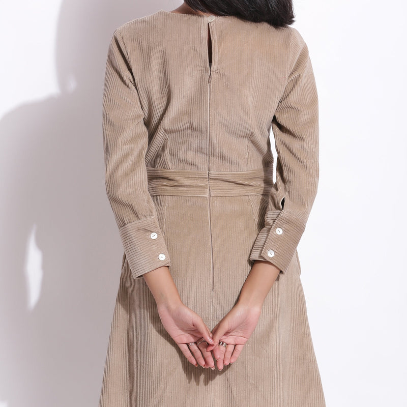 Back Detail of a Model wearing Taupe Beige Warm Cotton Corduroy Knee Length Dress