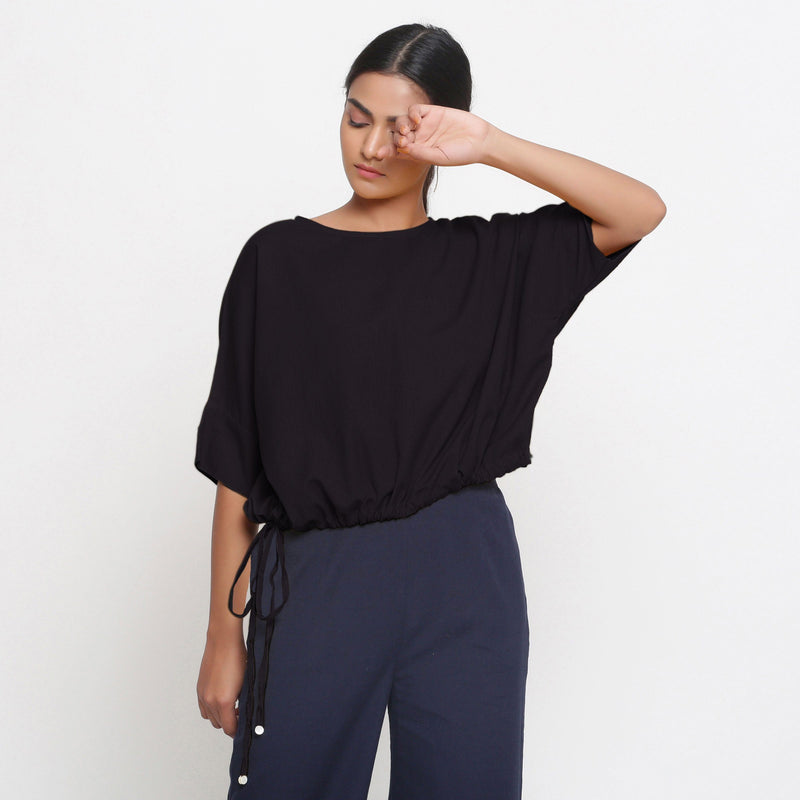 Front View of a Model wearing Solid Black Cotton Flax Blouson Top