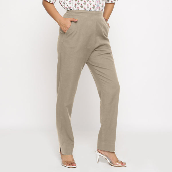 Right View of a Model wearing Cotton Flax Mid-Rise Beige Tapered Pant