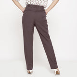 Back View of a Model wearing Cotton Flax Mid-Rise Brown Tapered Pant