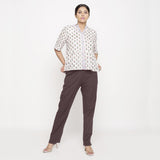 Front View of a Model wearing Cotton Flax Mid-Rise Brown Tapered Pant