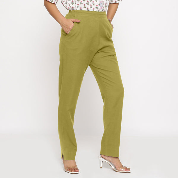 Right View Of a Model wearing Cotton Flax Mid-Rise Olive Green Tapered Pant