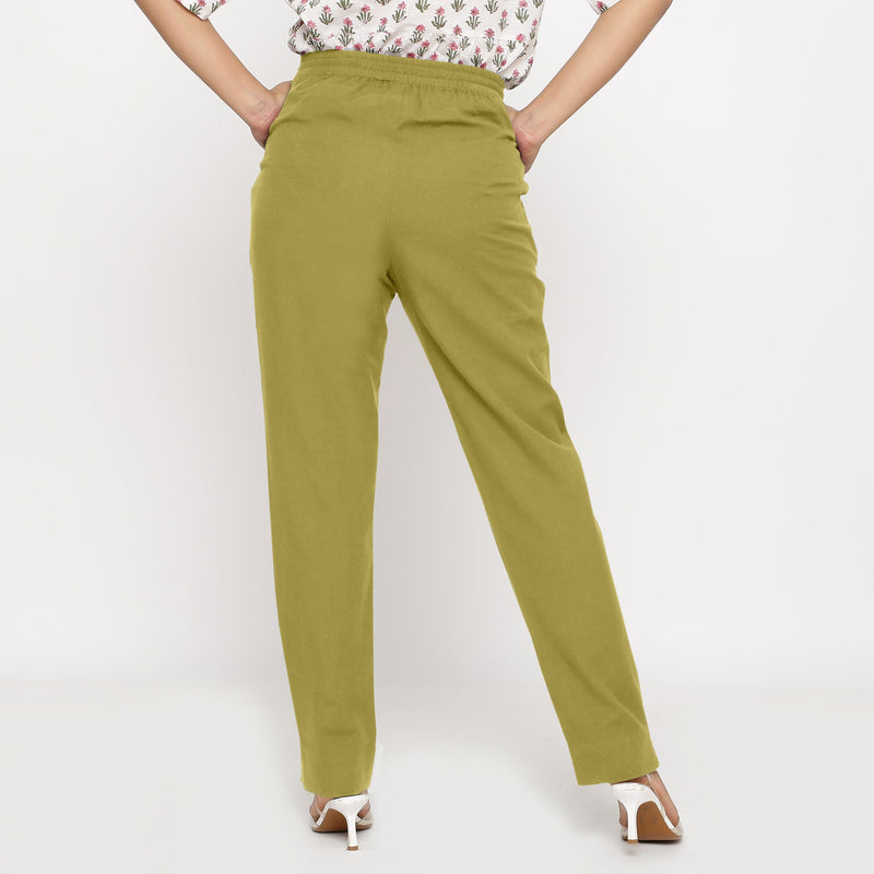 Back View of a Model wearing Cotton Flax Mid-Rise Olive Green Tapered Pant