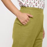 Right Detail of a Model wearing Cotton Flax Mid-Rise Olive Green Tapered Pant