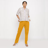 Front View of a Model wearing Cotton Flax Mid-Rise Yellow Tapered Pant