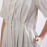 Left Detail of a Model wearing Handspun Cotton Muslin Button-Down Shirt Dress