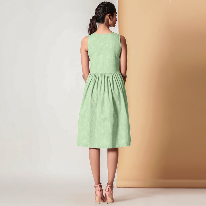 Back View of a Model wearing Cotton Sage Green Gathered Yoke Dress