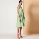 Right View of a Model wearing Cotton Sage Green Gathered Yoke Dress