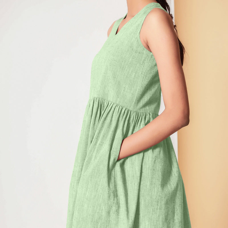 Left Detail of a Model wearing Cotton Sage Green Gathered Yoke Dress