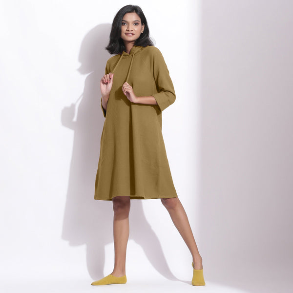 Front View of a Model wearing Cotton Waffle Olive Green Hoodie Dress