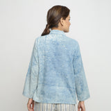 Back View of a Model wearing Blue Dabu Printed Natural Dyed Cotton Button-Down Top