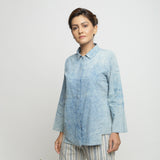 Front View of a Model wearing Blue Dabu Printed Natural Dyed Cotton Button-Down Top