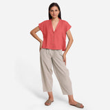 Front View of a Model wearing Deep Neck Button Down Top and Paneled Pant Set