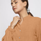 Front Detail of a Model wearing Desert Yellow 100% Linen Mandarin Collar Shirt