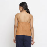 Back View of a Model wearing Solid Desert Yellow 100% Linen Relaxed Spaghetti Top