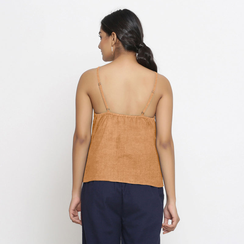 Back View of a Model wearing Solid Desert Yellow 100% Linen Relaxed Spaghetti Top