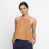 Front View of a Model wearing Solid Desert Yellow 100% Linen Relaxed Spaghetti Top