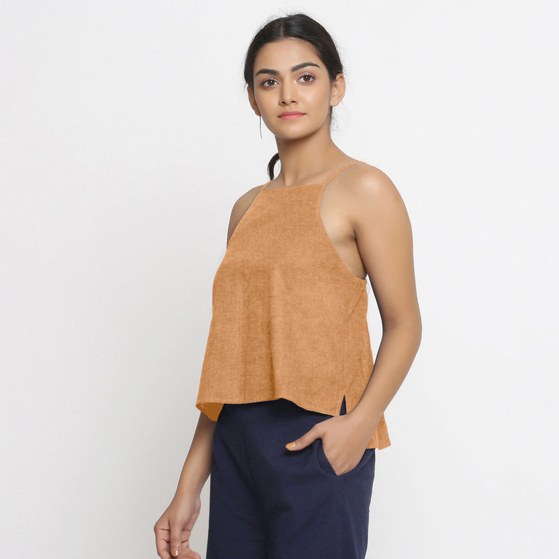 Left View of a Model wearing Solid Desert Yellow 100% Linen Relaxed Spaghetti Top