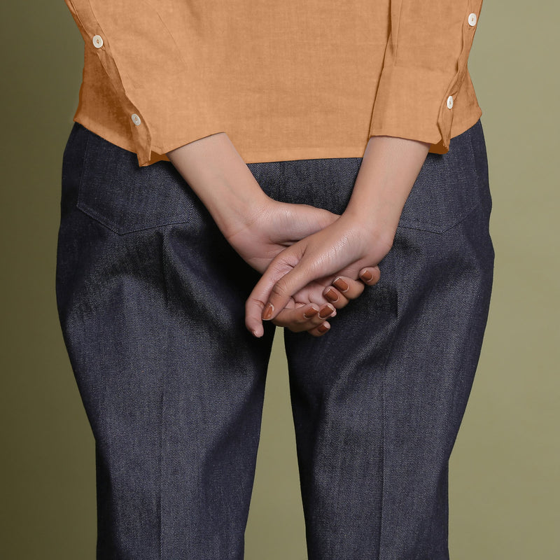 Back Detail of a Model wearing Desert Yellow Linen Cuff Sleeves Button-Down Shirt