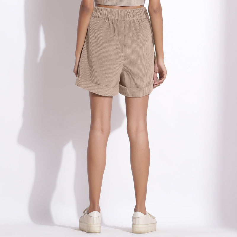Back View of a Model wearing Dusk Beige Cotton Corduroy Baggy Shorts