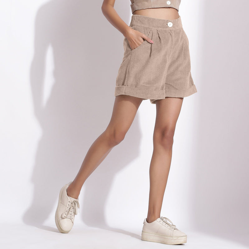 Right View of a Model wearing Dusk Beige Cotton Corduroy Baggy Shorts