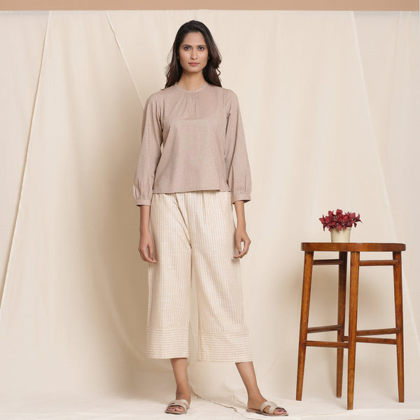 Front View of a Model wearing Dusk Beige Cotton Striped Elasticated Pant