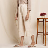 Left View of a Model wearing Dusk Beige Warm Cotton Culottes Striped Pant