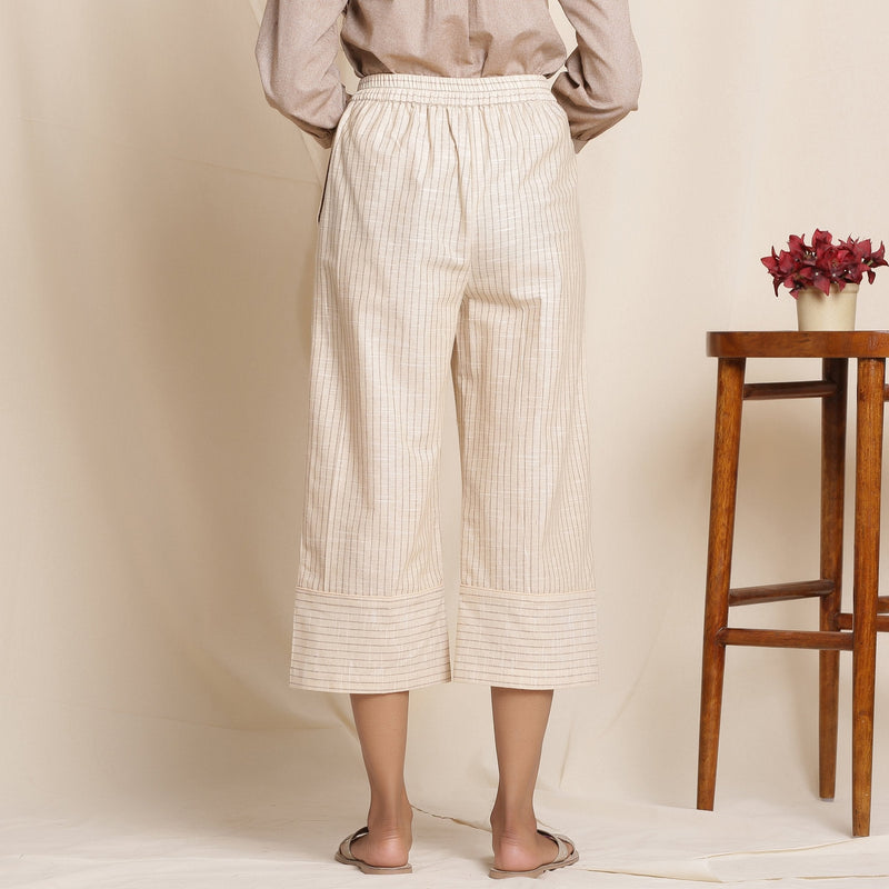 Back View of a Model wearing Dusk Beige Warm Cotton Culottes Striped Pant