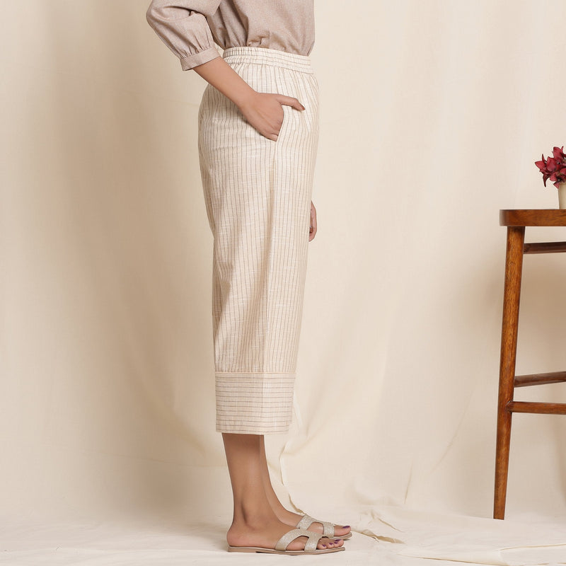 Right View of a Model wearing Dusk Beige Warm Cotton Culottes Striped Pant