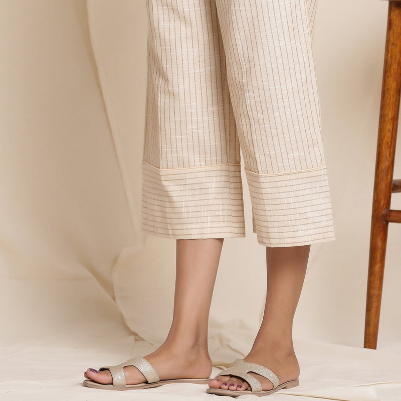 Left Detail of a Model wearing Dusk Beige Warm Cotton Culottes Striped Pant