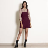 Front View of a Model wearing Dusk Brown Top and Berry Wine Romper Set