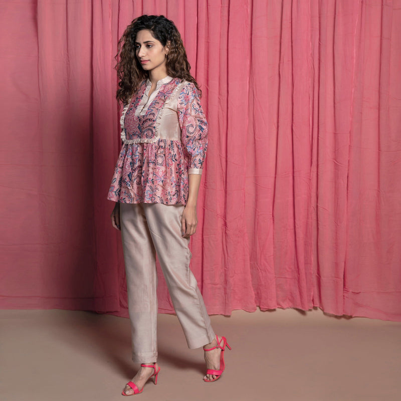 Left View of a Model wearing Dust Pink Chanderi Cotton Block Print Frilled Top