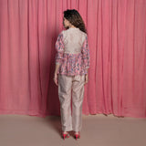 Back View of a Model wearing Dust Pink Chanderi Cotton Block Print Frilled Top