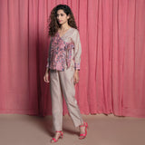 Left View of a Model wearing Dust Pink Chanderi Block Printed Wrap Cotton Top
