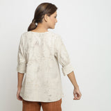 Back View of a Model wearing Beige Dabu Printed Deep Neck A-Line Top