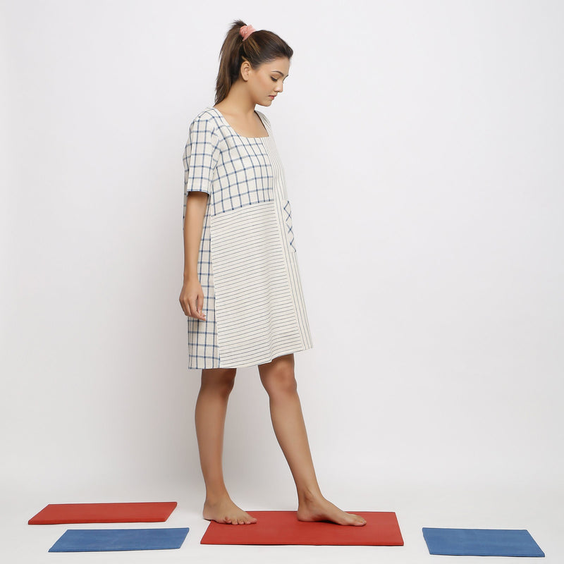 Right View of a Model wearing Ecru and Blue Vegetable Dyed Paneled Dress