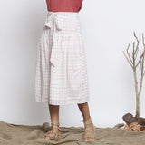 Front View of a Model wearing Ecru and Red Handspun Gathered Skirt